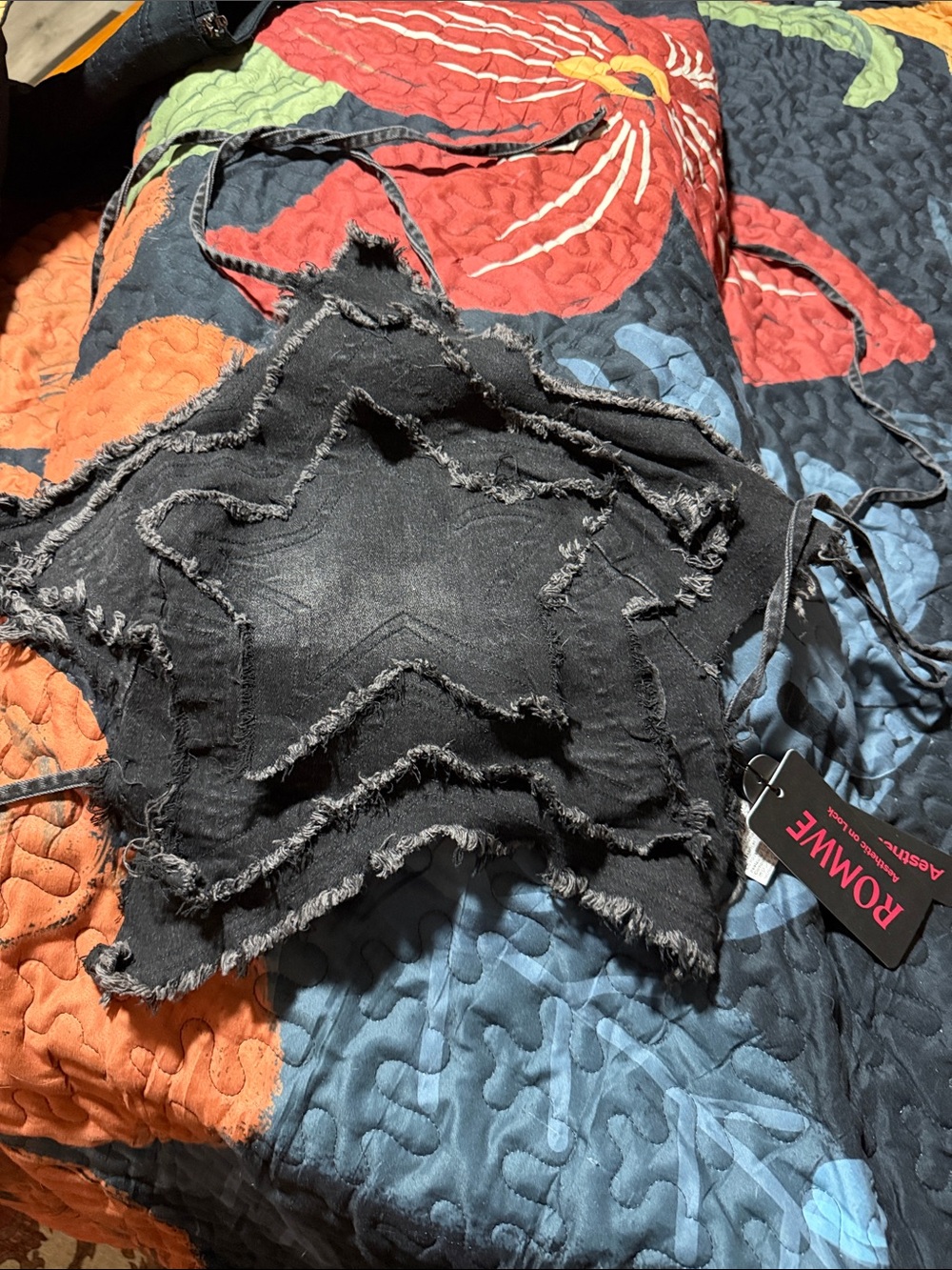 Distressed black denim star top